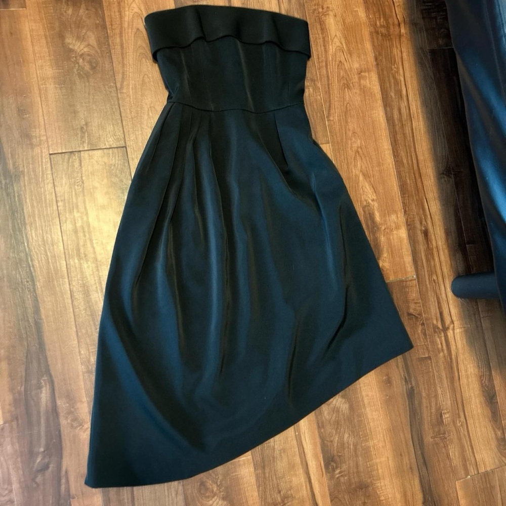 Black asymmetrical mini dress perfect for holiday parties